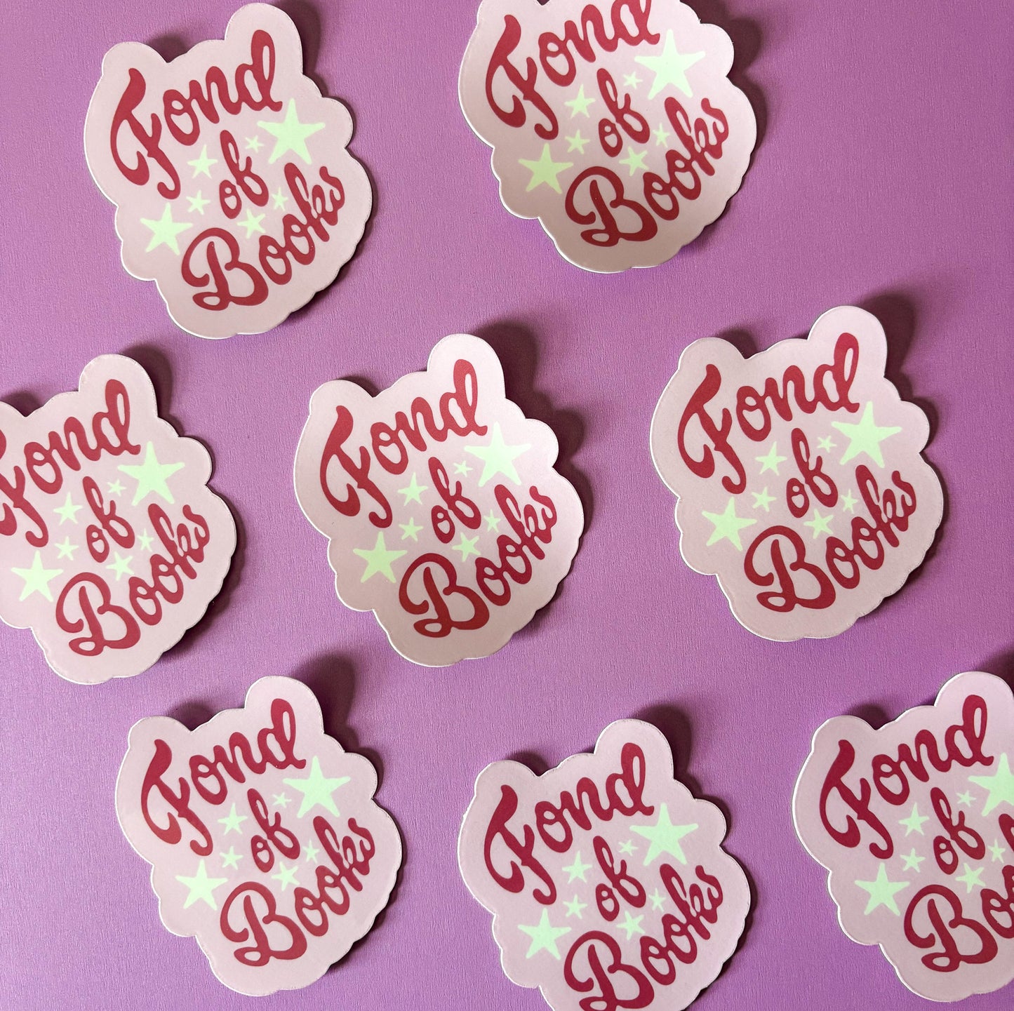Stickers with 'Fond of Books' text on a purple background
