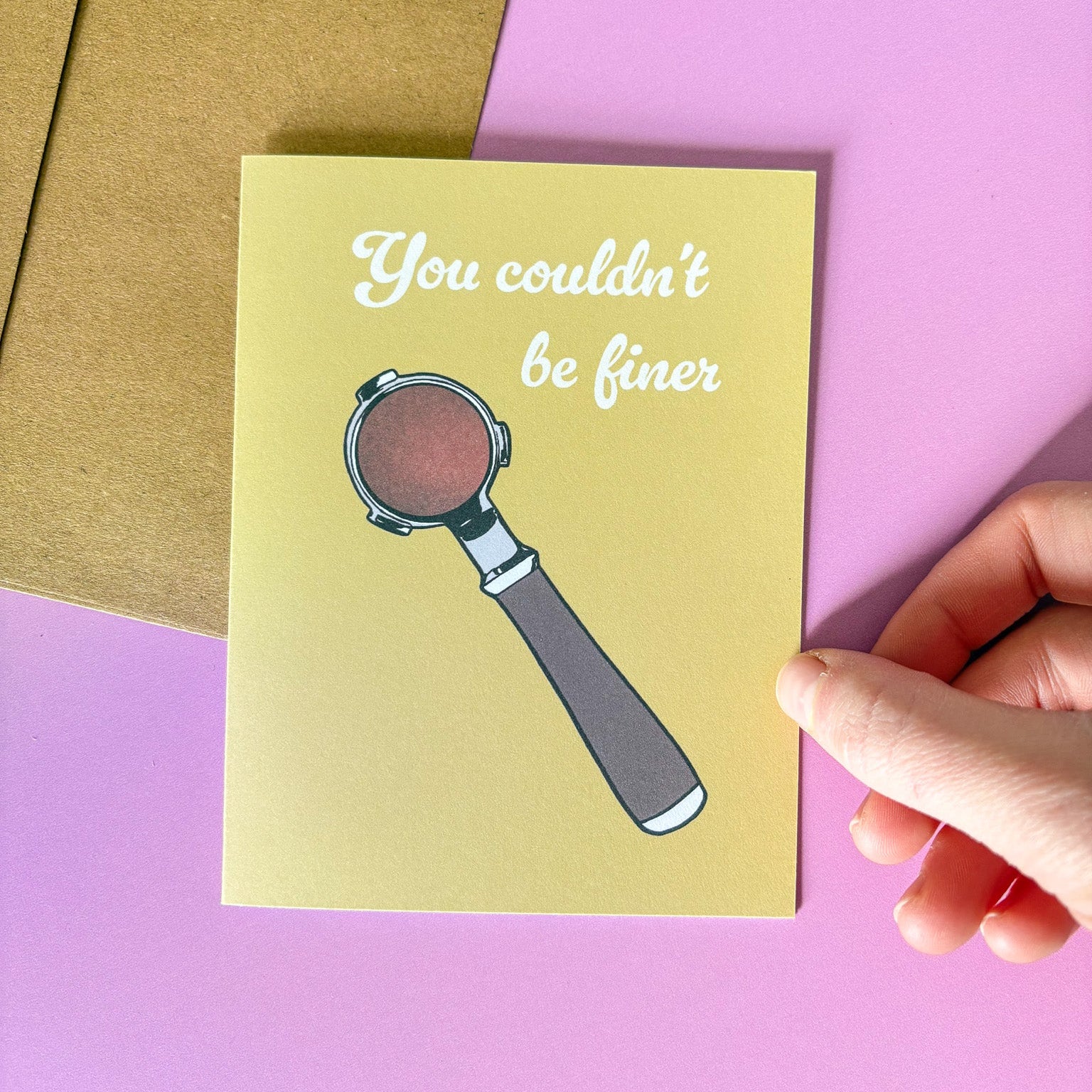 Greeting card with espresso portafilter illustration and text on a pink background