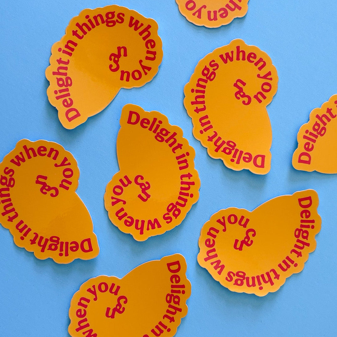 Orange stickers with red text on a blue background