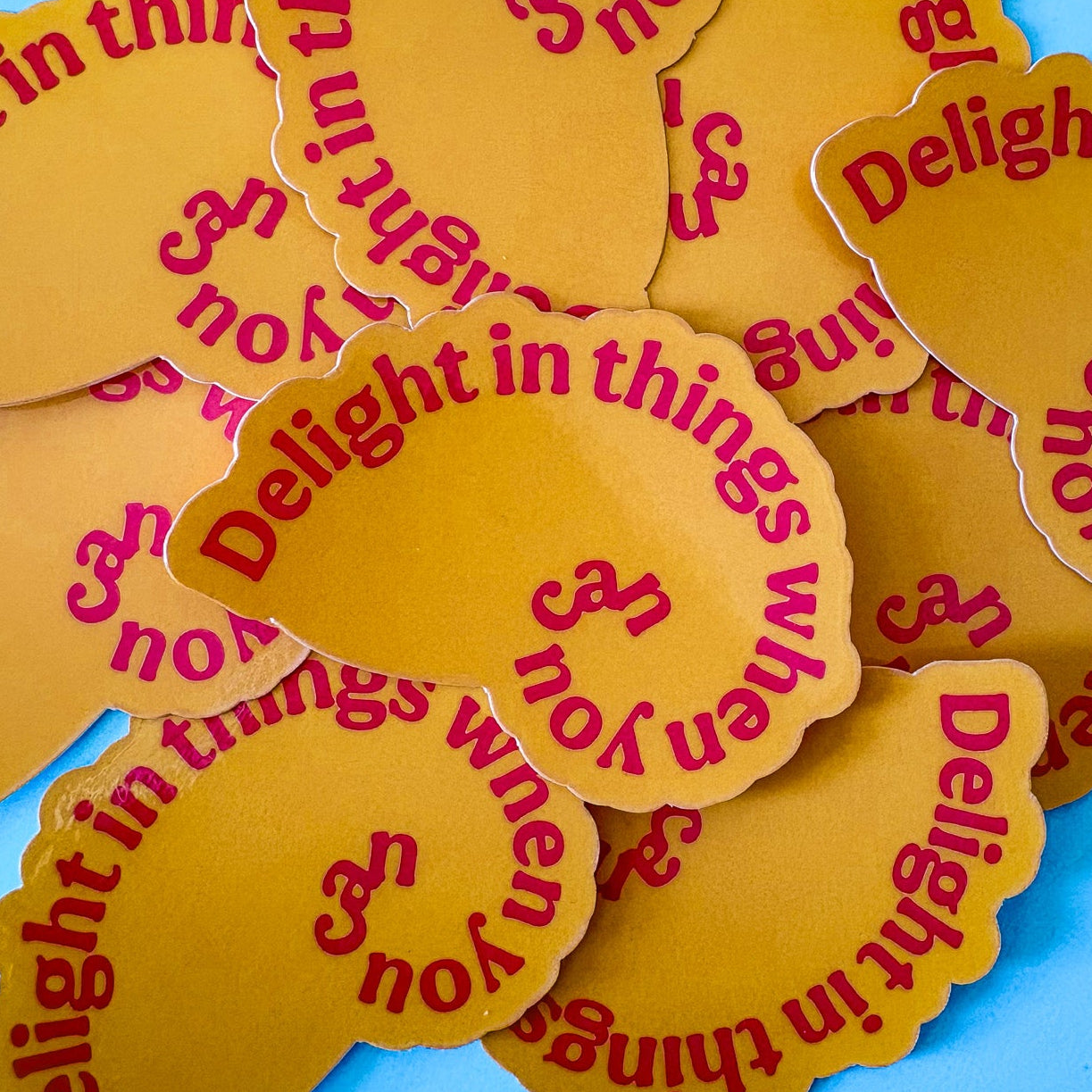 Yellow stickers with red text on a blue background