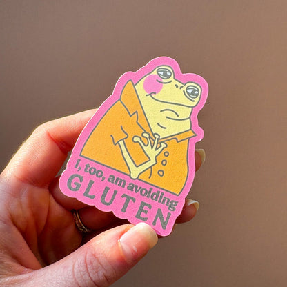 Hand holding the avoiding gluten frog sticker